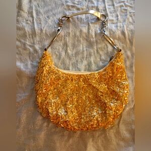Beautiful vintage hobo purse in gold tones. Size is small.